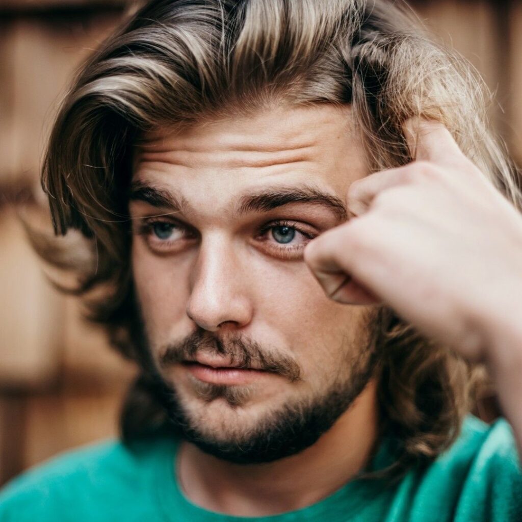 young man wonders whether to see osteo chiro or physio